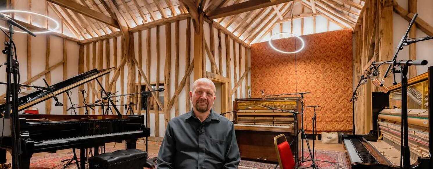 Engineer Stuart Bruce sat in the recording studio surrounded by the three pianos